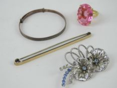 A sterling silver floral brooch, together with a 9ct gold and silver oversized bar brooch,