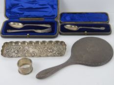 An HM silver pen tray having repouse birds in floral scene,