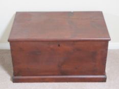 A late 19th century stained pine lidded trunk with end handles, 71 x 42 x 40cm.