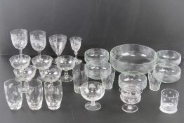A quantity of assorted etched and engraved glassware including sundaes, glasses, bowls,
