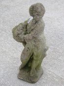 A stoneware garden figurine standing 72cm high.