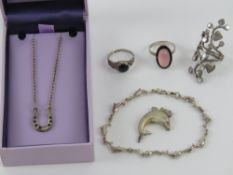 A silver horseshoe pendant together with 925 silver dolphin pendant and bracelet,