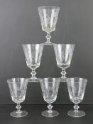 A quantity of six matching engraved wine glasses.