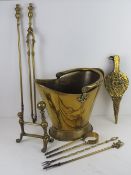 A brass coal bucket together with a quantity of fireside tools.