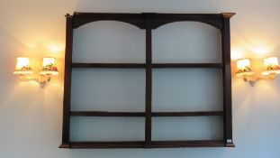 A Georgian double arch top wall rack in oak measuring 115cm high x 147cm wide, 15cm deep.