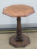 A good octagonal occasional side table in oak raised over gun barrel stem, 50 x 50 x 64cm.