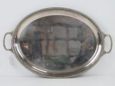 A silver plated serving tray having Celtic pattern border and twin carry handles, 48.5 x 31.