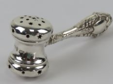 An HM silver rattle in the form of an auctioneer's hammer or gavel hallmarked Birmingham and