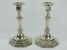 A pair of silver plated Georgian style octagonal candlesticks, each with removable drip tray,