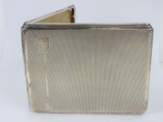 An HM silver Art Deco cigarette case having geometric design to front,