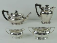 An Art Deco HM silver four piece tea service comprising tea pot and hot water pot each with