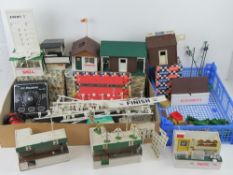 A quantity of assorted Triang Scalextric track and trackside buildings, some in original boxes,