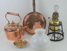 A large and impressive copper and brass kettle, 31cm high.