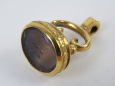 A gilt metal fob having foil backed 'Say Yes' seal (slightly a/f), fob 3cm in length, base 2 x 1.