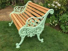 A pair of Victorian Carron Works cast iron garden bench ends, powder coated light mint green,