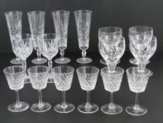 A set of six cut glass aperitif glasses together with four cut glass champagne flutes,