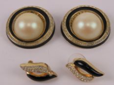 A pair of vintage Christian Dior stud earrings having black enamel and white stones upon,