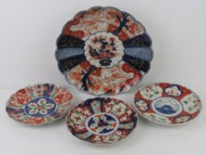 A large 19th century Imari panelled and fluted plate, 31cm dia.