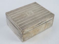An HM silver cigarette box having cedar wood lining, engraved to lid 'Vice G.C. 1929', measuring 10.