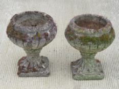 A pair of garden stoneware pedestal planters each standing 38cm high.