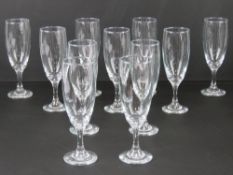 A set of eleven champagne flutes.
