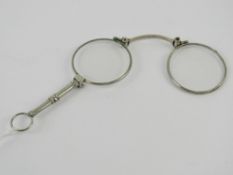 A pair of Art Deco folding lorgnette spectacles, having chatelaine loop,