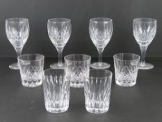 A set of four Stuart crystal wine glasses together with a pair of Stuart crystal whisky tumblers