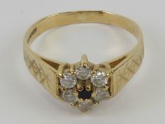 A 9ct gold ring having sapphire and cz floral cluster, hallmarked 375, size O, 2.3g.