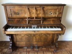 A good inlaid walnut upright overstrung piano by Monk & Schuppisser Ld of London as retailed by GS