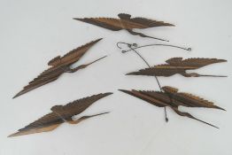 A delightful Oriental carved wood mobile in the form of flying cranes.