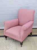 A vintage oversprung armchair of classic proportions upholstered in attractive pink fabric,