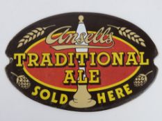 An enamelled sign for Ansells Traditional Ale 29cm wide.