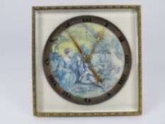 A heavy framed glass and brass easel desk clock having clockwork movement.