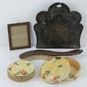 A painted papier mache crumb scoop with associated brush,