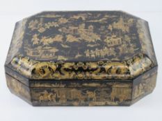 A Chinese export black laquer and gilt decorated games box, 19thC, of octagonal form,