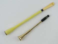 A good engine turned guilloche enamelled smoking stick with ivory mouthpiece measuring 13.