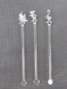 Three glass cocktail swizzle sticks each having animal finial being dove, swan and mouse.