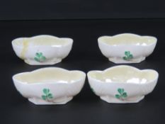 A rare set of four Belleek quatreform caviar bowls, each hand painted with clover upon,