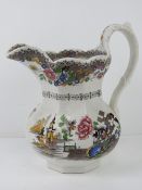 An Ironstone 'Chinese Temple' transfer ware octagonal jug standing 26cm high.