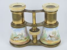 A delightful pair of handpainted ceramic and brass opera glasses each with ivory eyepiece,