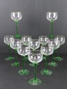 A set of twelve green stem part gilded Hocks.
