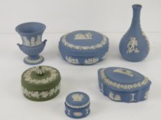 Five items of blue Wedgwood Jasper ware together with a single green item.