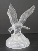 A glass paperweight in the form of an eagle standing 20cm high, no apparent maker's mark.