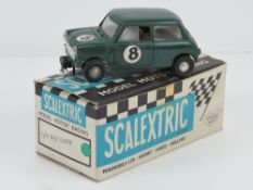 A Triang Scalextric Austin Mini Cooper (C76) in green with original box.