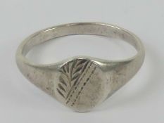 A 925 silver signet ring having half floral engraving, size O.