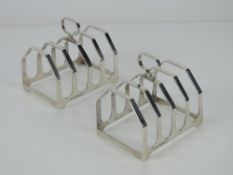 A pair of HM silver toast racks, each hallmarked Birmingham 1935,