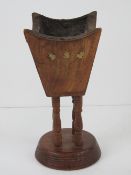 An unusual wooden and brass inlaid censer raised over turned base, 20cm high.