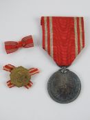 A WWII Japanese Red Cross Medal and lape