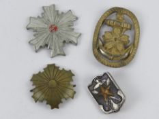 A quantity of WWII Japanese badges. Four