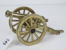 A British made brass model of a cannon h
